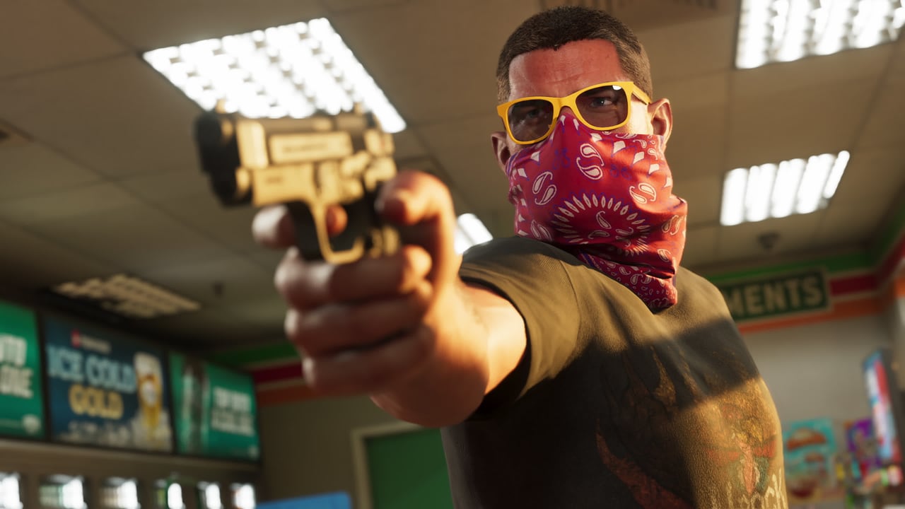 Official GTA VI image of Jason Duval in a convenience store, his face covered by a red bandana and yellow sunglasses, pointing a pistol toward the camera.