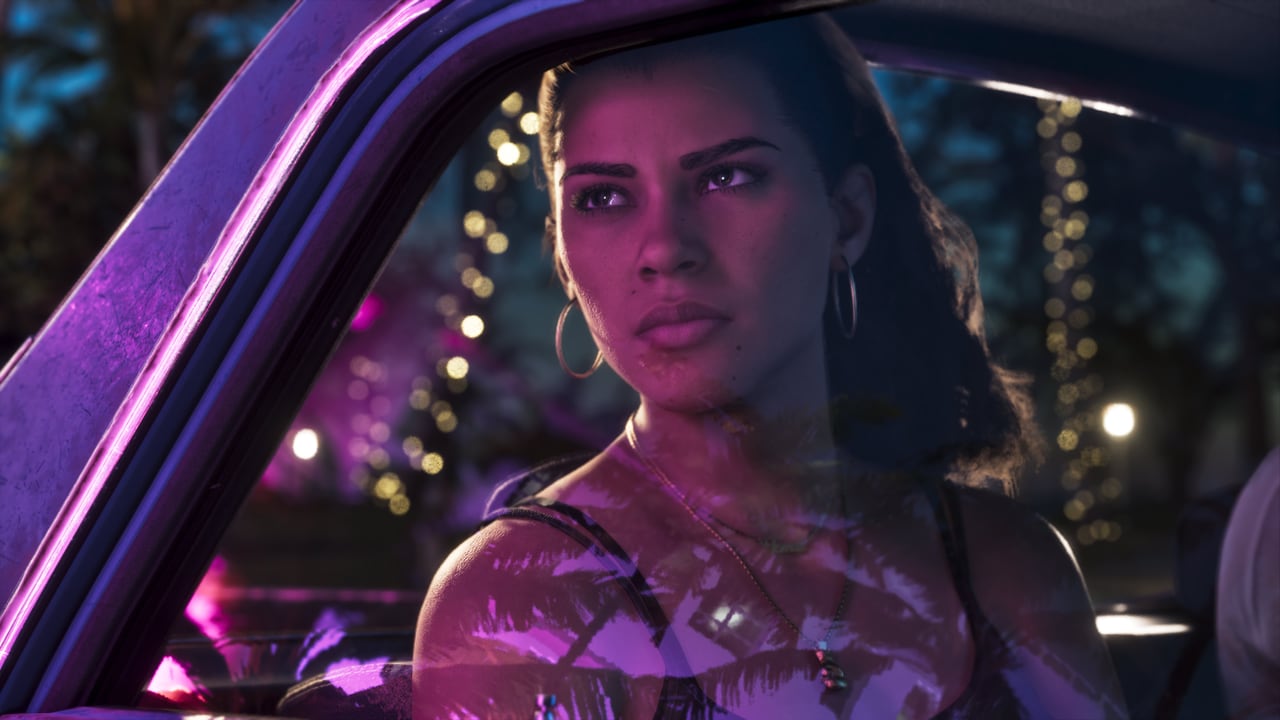 Official GTA VI screenshot of Lucia Caminos at night in a car lit by purple neon, looking out of the window.